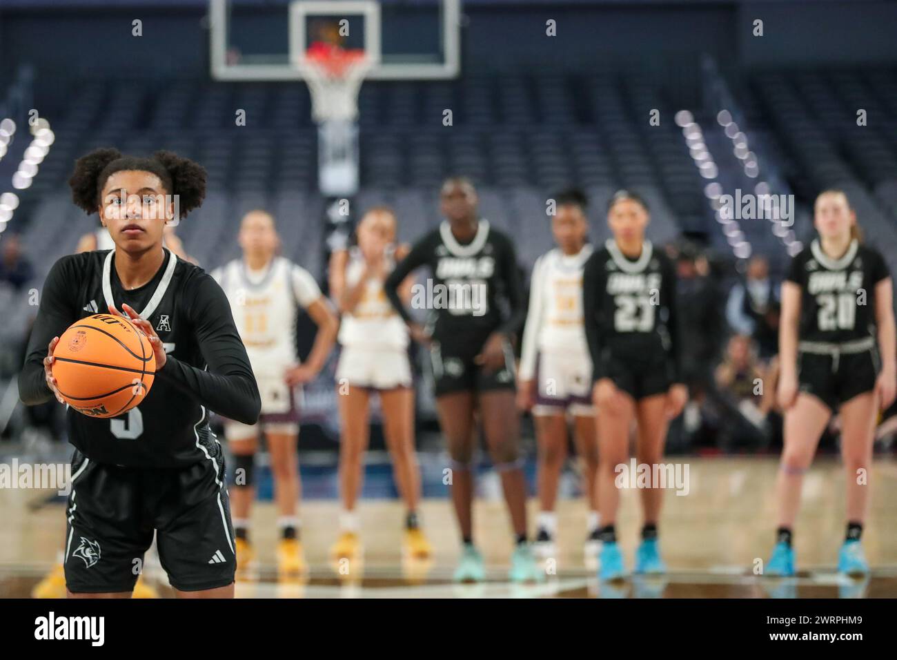 With her ticket for the womens basketball hires stock photography and