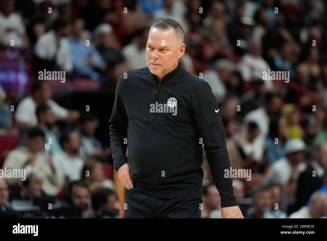 Denver Nuggets head coach Michael Malone walks on the court during the