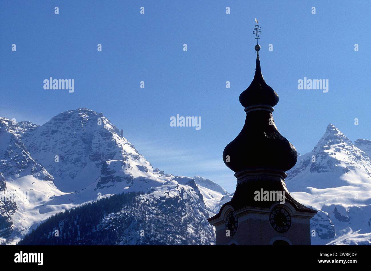 Tower of  Lofer Church and Alps, Tyrol, Austria, Europe Stock Photo