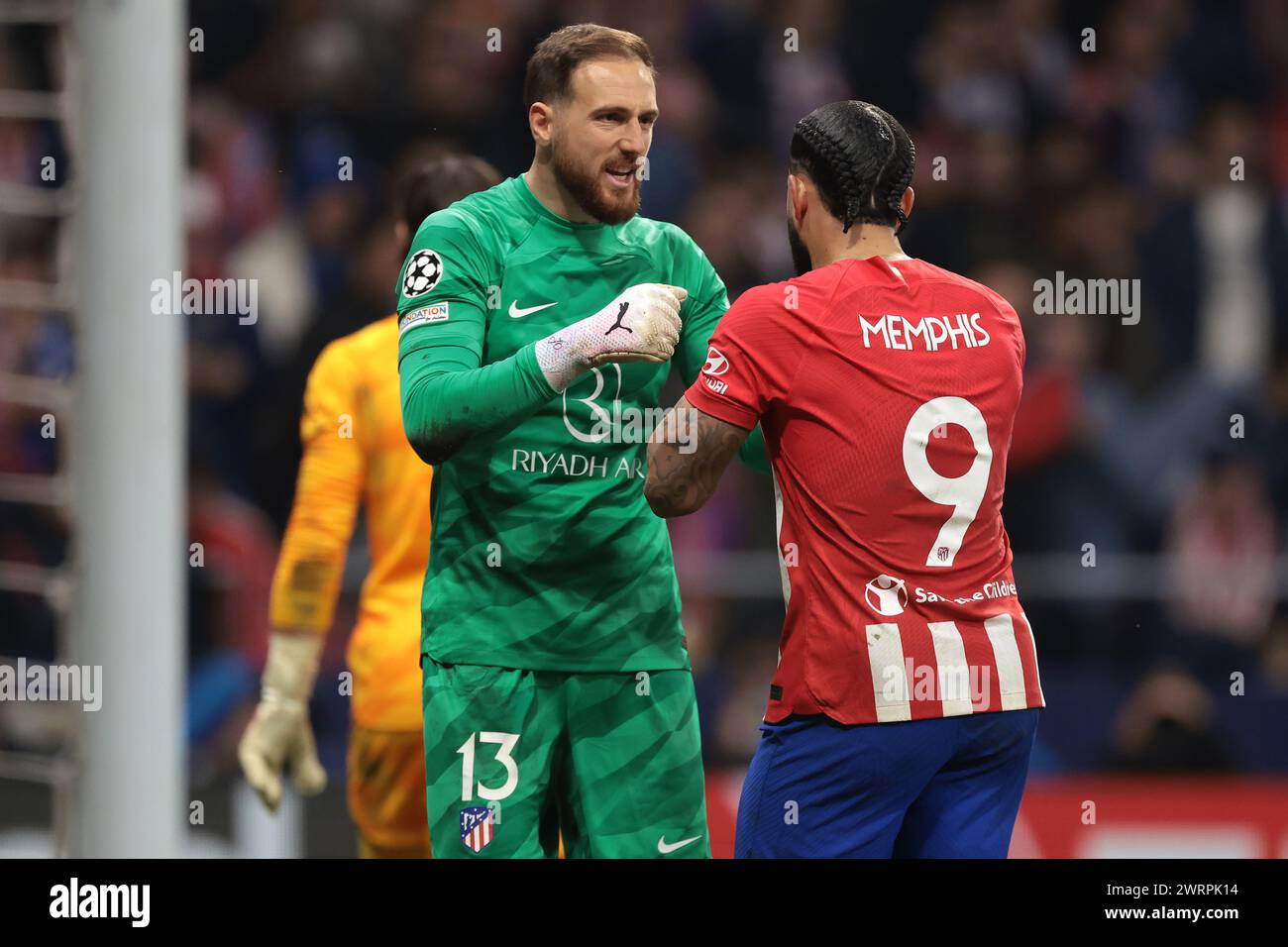 Madrid, Spain. 13th Mar, 2024. Memphis Depay of Atletico Madrid celebrates with team mate Jan Oblak after scoring in the penalty shoot out of the UEFA Champions League match at Estadio Metropolitano, Madrid. Picture credit should read: Jonathan Moscrop/Sportimage Credit: Sportimage Ltd/Alamy Live News Stock Photo