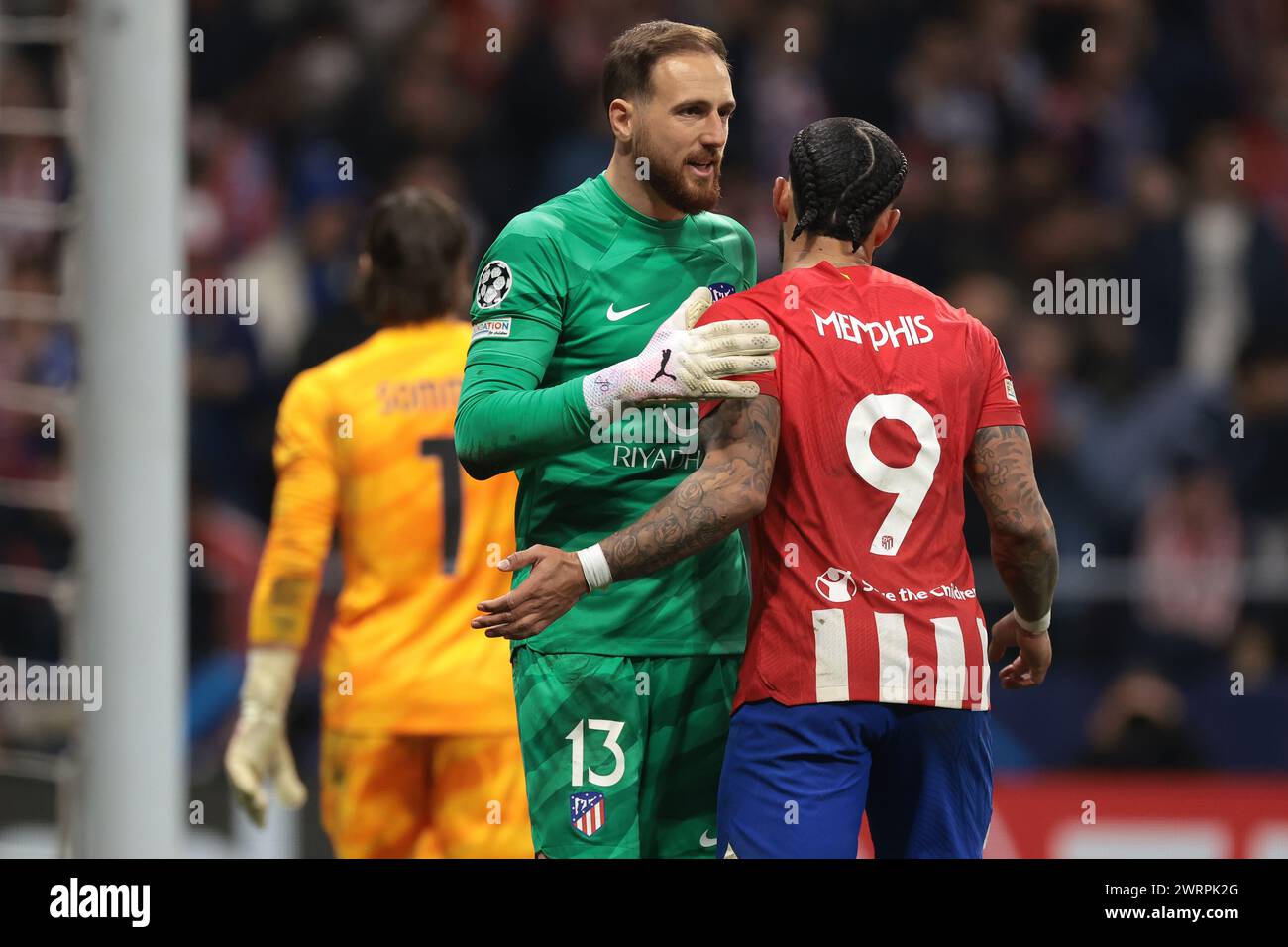 Madrid, Spain. 13th Mar, 2024. Memphis Depay of Atletico Madrid celebrates with team mate Jan Oblak after scoring in the penalty shoot out of the UEFA Champions League match at Estadio Metropolitano, Madrid. Picture credit should read: Jonathan Moscrop/Sportimage Credit: Sportimage Ltd/Alamy Live News Stock Photo
