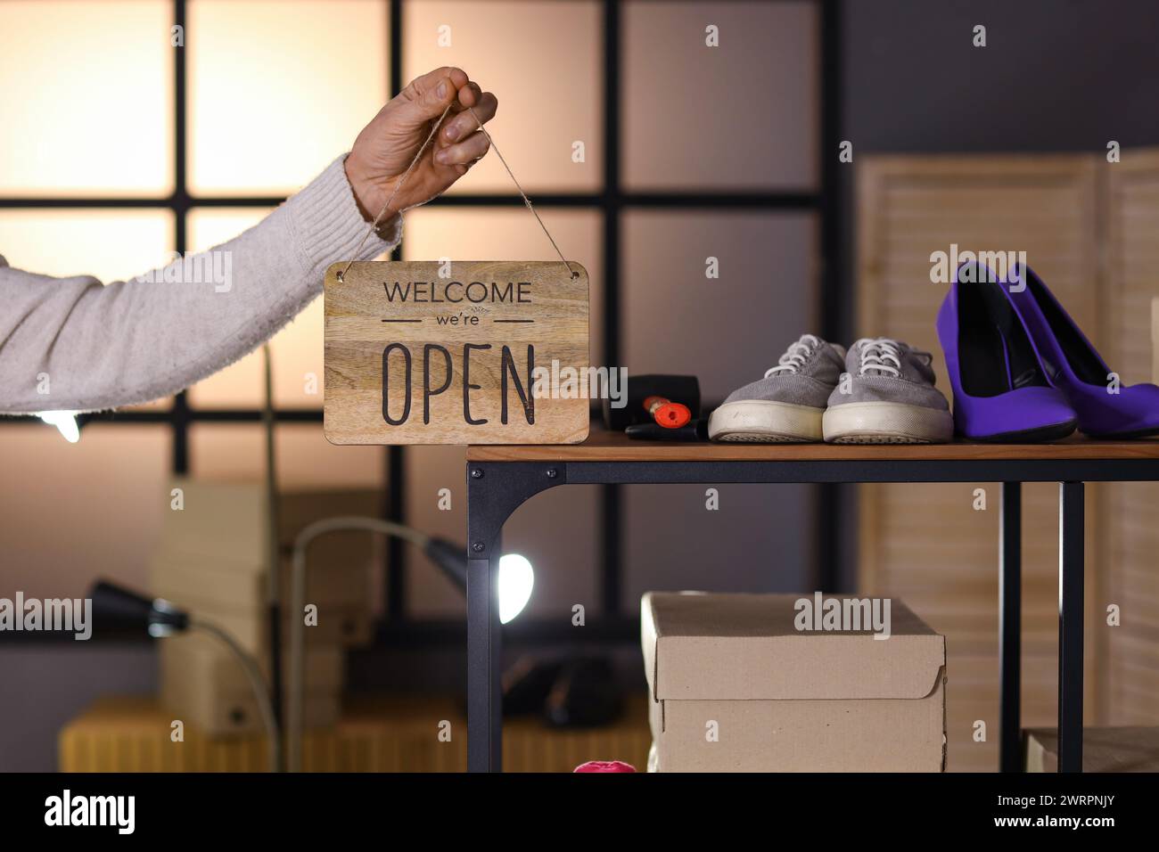 Shoemaker Open Sign Mature shoemaker with OPEN sign in workshop, closeup Stock Photo - Alamy