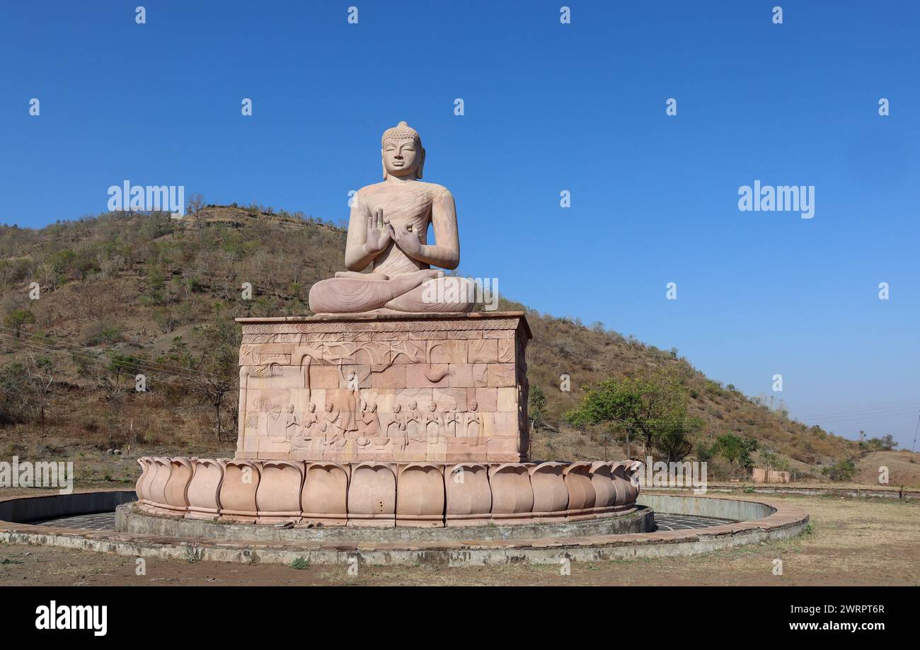 Beautiful Buddha Statue located in Aurangabad District,Maharashtra state -India. Buddha Statue with Dramatic sky in background. Stock Photo