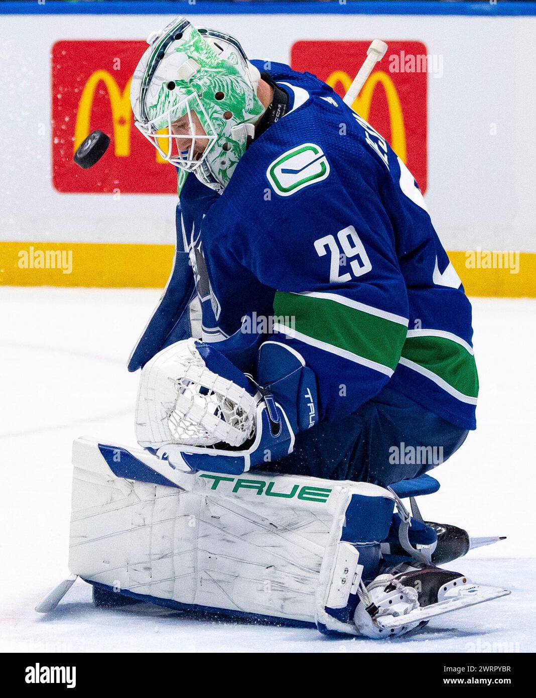 Vancouver Canucks Goaltender Casey DeSmith Stops The Puck During The vancouver-canucks-goaltender-casey-desmith-stops-the-puck-during-the
