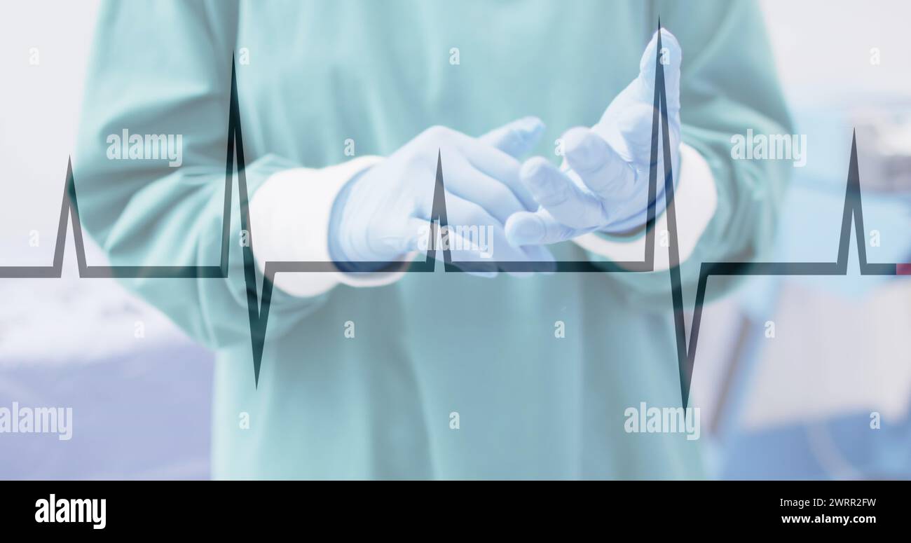 Image of cardiograph over surgeon wearing medical gloves at hospital ...