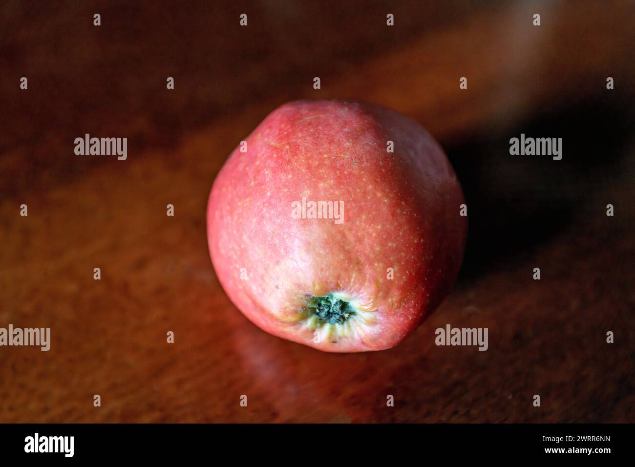 fresh red apple on wooden table Stock Photo