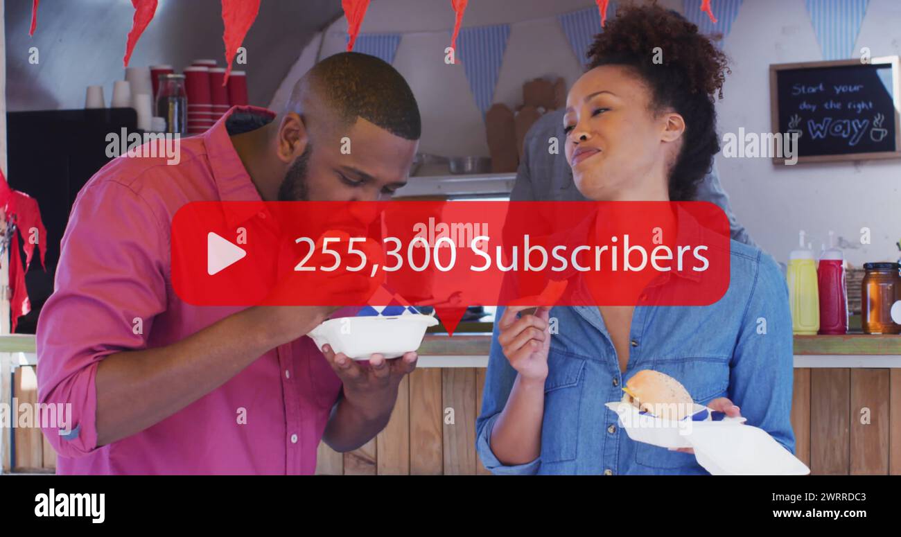 Image of social network subscribers notification over happy biracial couple at cafe Stock Photo
