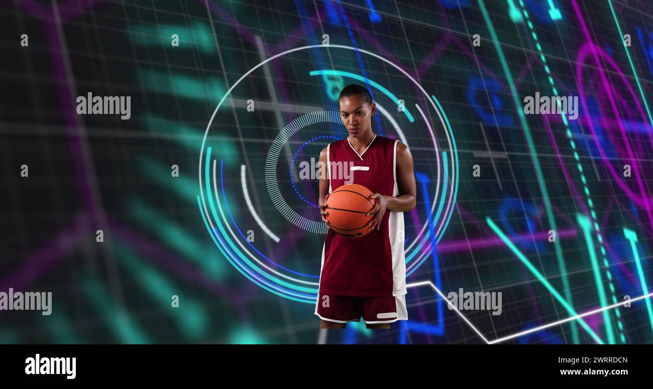 Image of african american female basketball player over scope scanning on black background Stock Photo