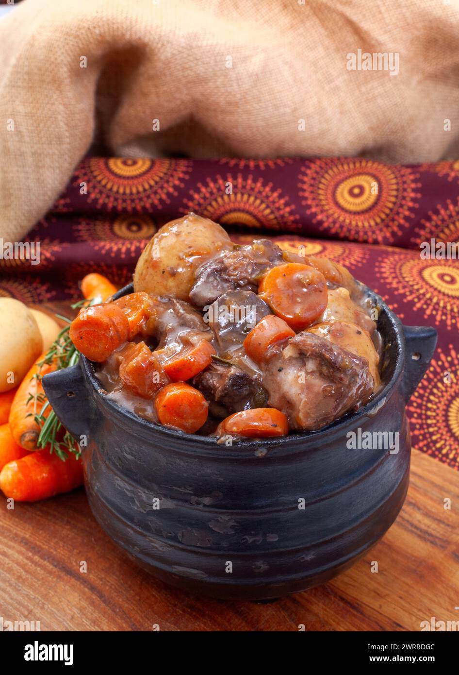 Traditional South African pot (potjie). Stew cooked in cast iron pot ...