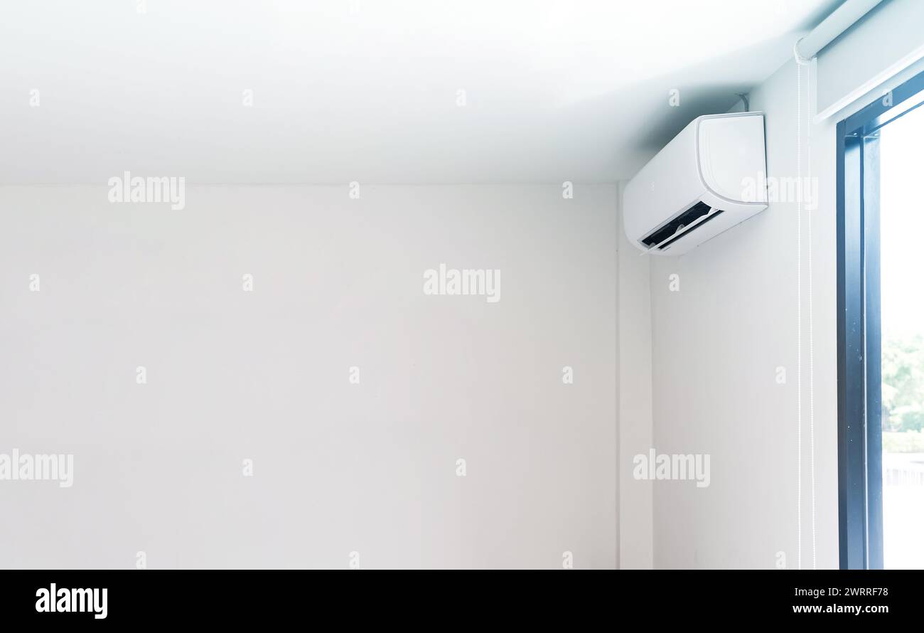 Air conditioner on white wall background Stock Photo - Alamy