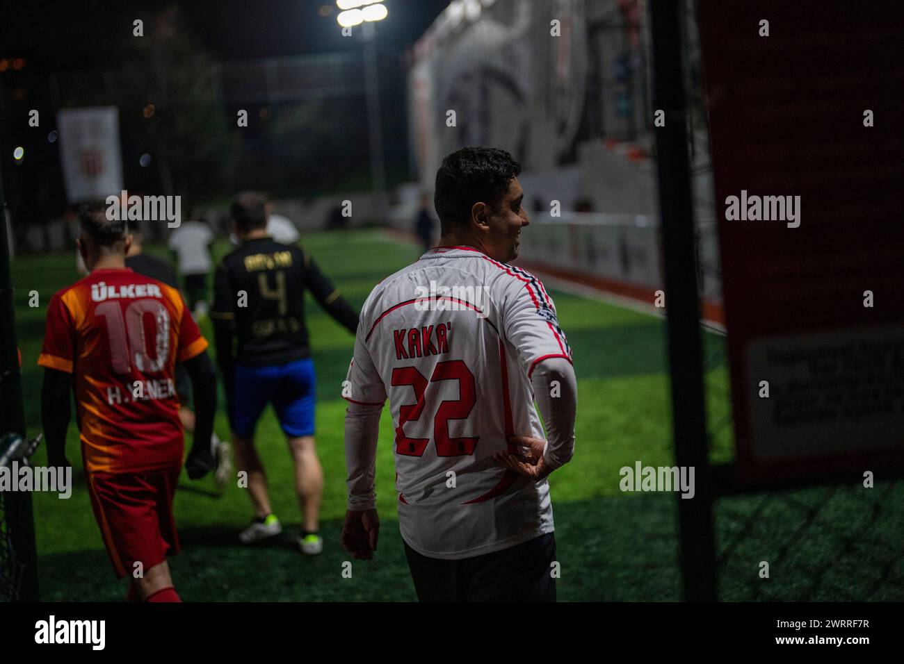 Amateur players enter the pitch before playing a recreational soccer