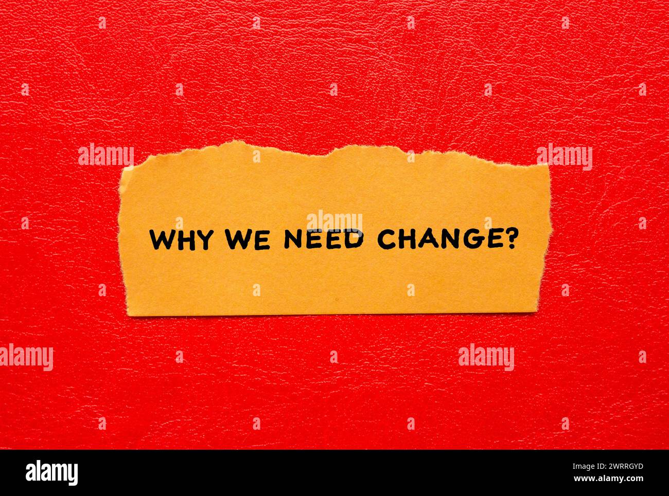 Why we need change words written on torn paper with red background. Conceptual symbol. Copy space. Stock Photo