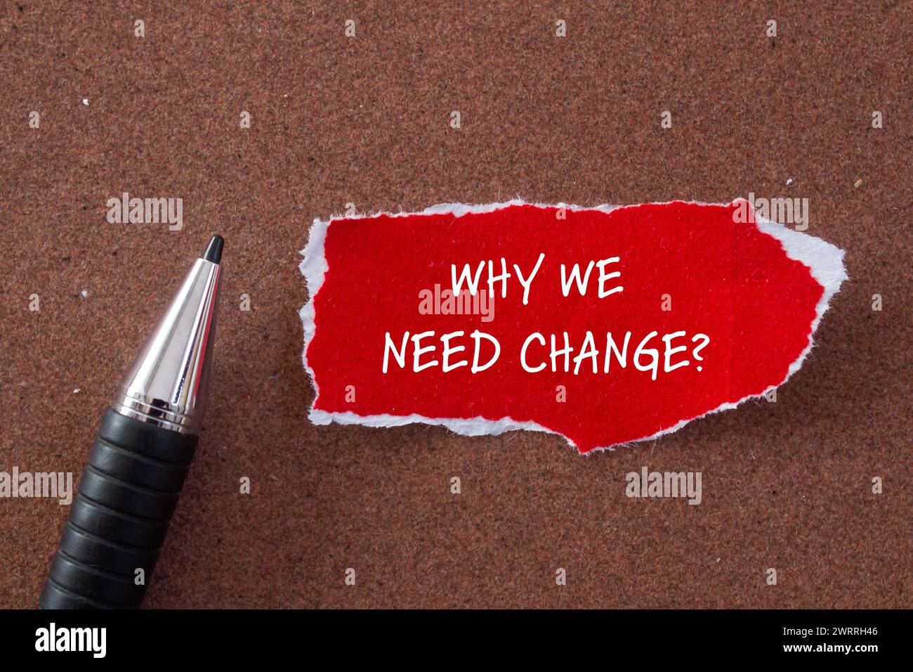 Why we need change words written on red torn paper with brown background. Conceptual symbol. Copy space. Stock Photo