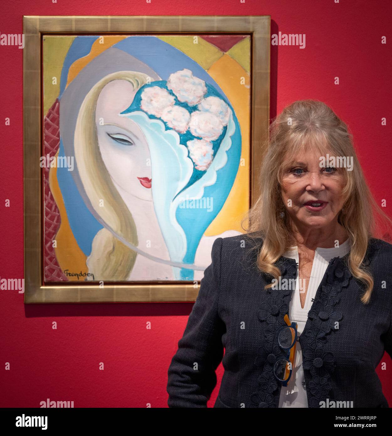 Christie's, London, UK. 14th Mar, 2024. The Pattie Boyd Collection will be offered by Christie's online from 8 to 22 March. A four-time Vogue cover-girl, Boyd is widely regarded as rock's most legendary muse - as the former wife of both George Harrison and Eric Clapton, she inspired some of the greatest love songs of all time. Image: Pattie Boyd with the original artwork by E. Frandsen De Schomberg used for the cover of Derek and The Dominos album Layla and Other Assorted Love Songs (estimate: £40,000-60,000). Credit: Malcolm Park/Alamy Live News Stock Photo