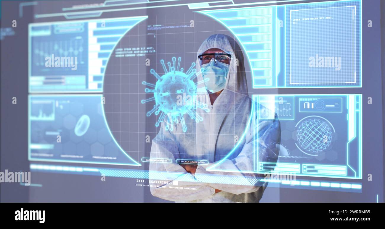 Image of green virus cells over caucasian male lab worker in safety clothes with digital screen Stock Photo