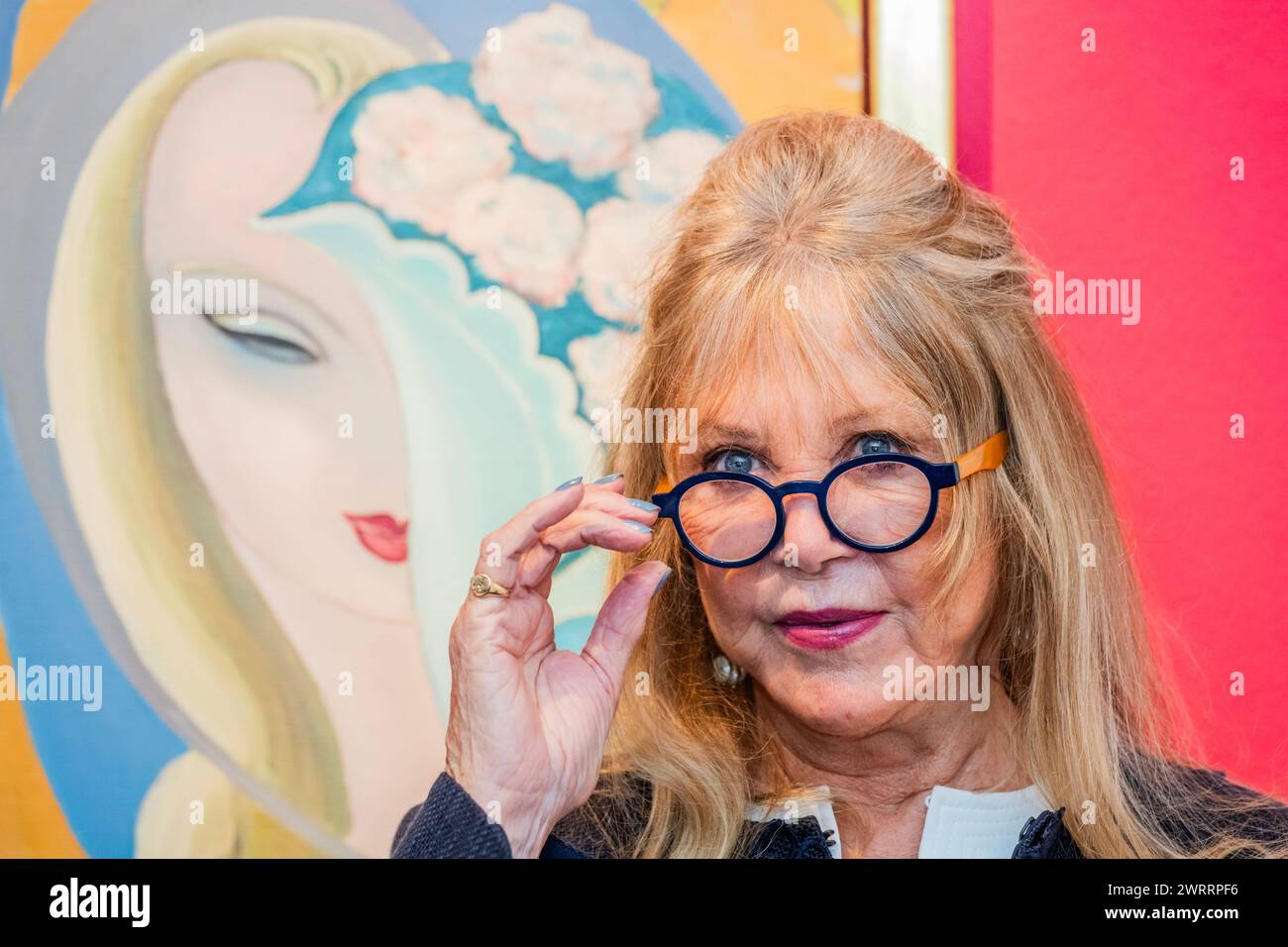 London, UK. 14 Mar 2024. Pattie with the original artwork by E. Frandsen De Schomberg used for the cover of Derek and The Dominos album Layla and Other Assorted Love Songs, (estimate: £40,000-60,000) - A preview of the Pattie Boyd Collection Sale at Christies in London. She was a model, muse, photographer, and icon and the sale includes original album cover artwork and handwritten lyrics alongside love letters, drawings, photographs, fashion, jewellery and watches. Estimates range from £300 to £60,000. The online sale closes on 22 March and is on public view from 15 to 21 March. Credit: Guy Be Stock Photo