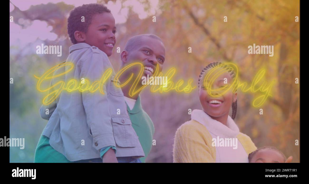 Image of good vibes only over happy african american family in park Stock Photo