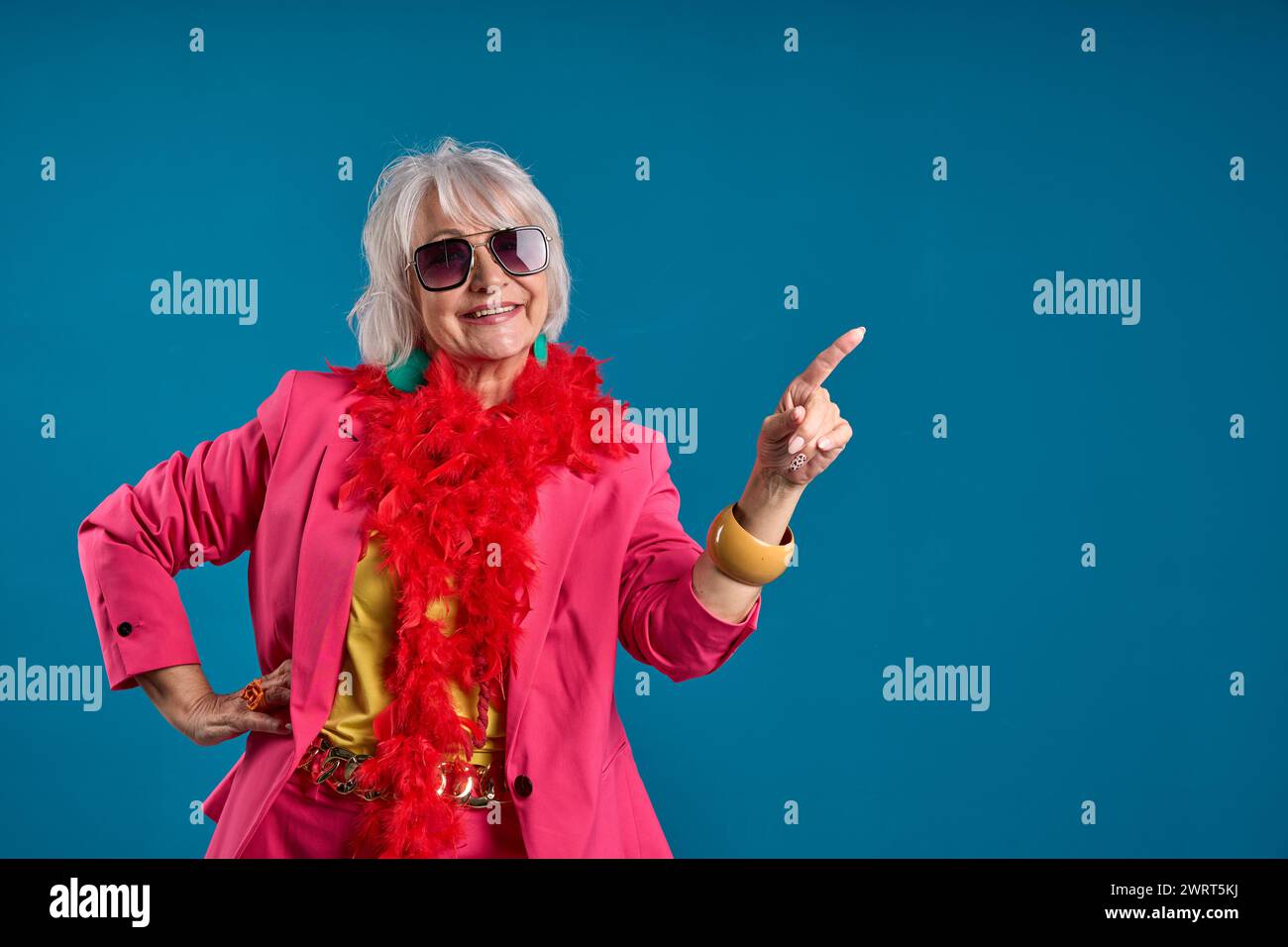 Senior fashion woman exuding confidence and pointing to an offer Stock Photo