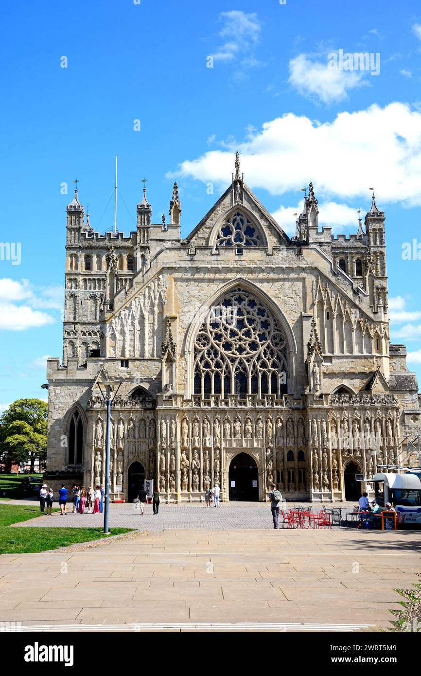 Front view of the Cathedral (Cathedral Church of Saint Peter in Essex) with tourists enjoying the setting, Exeter, Devon, UK, Europe. Stock Photo