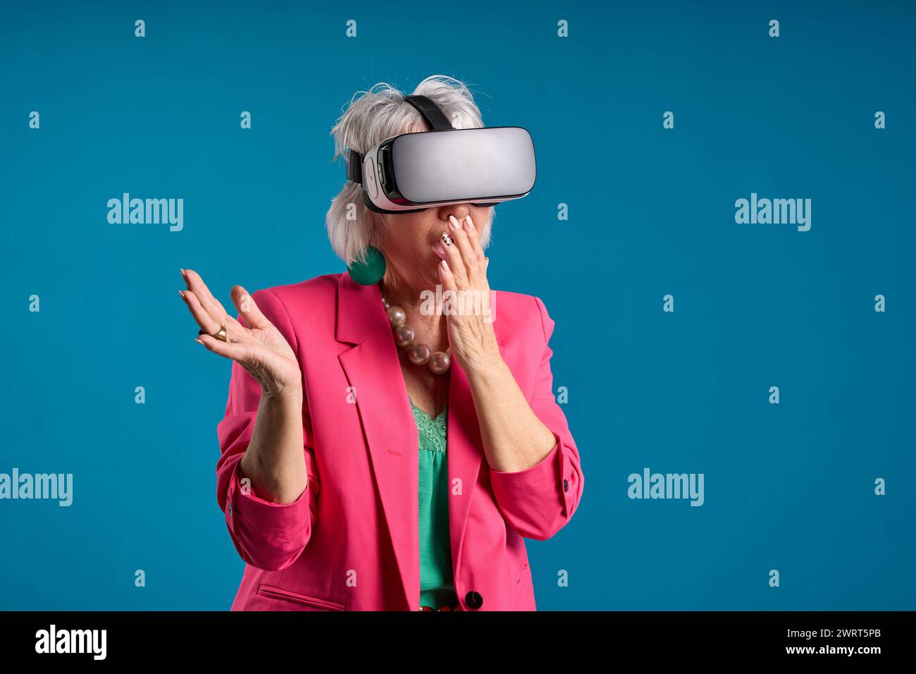 Senior woman can't believe what she sees in virtual reality headset ...