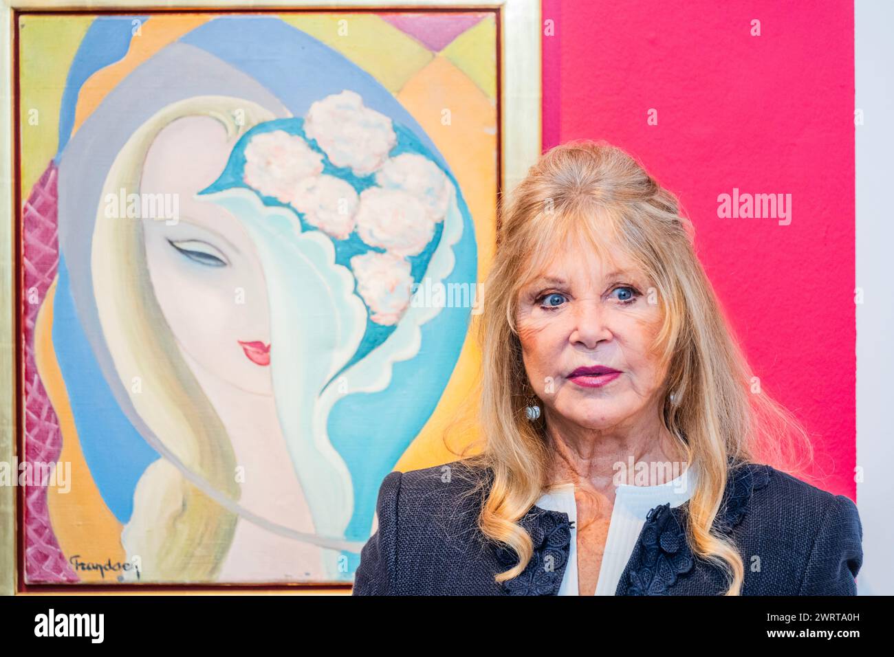 London, UK. 14 Mar 2024. Pattie with the original artwork by E. Frandsen De Schomberg used for the cover of Derek and The Dominos album Layla and Other Assorted Love Songs, (estimate: £40,000-60,000) - A preview of the Pattie Boyd Collection Sale at Christies in London. She was a model, muse, photographer, and icon and the sale includes original album cover artwork and handwritten lyrics alongside love letters, drawings, photographs, fashion, jewellery and watches. Estimates range from £300 to £60,000. The online sale closes on 22 March and is on public view from 15 to 21 March. Credit: Guy Be Stock Photo