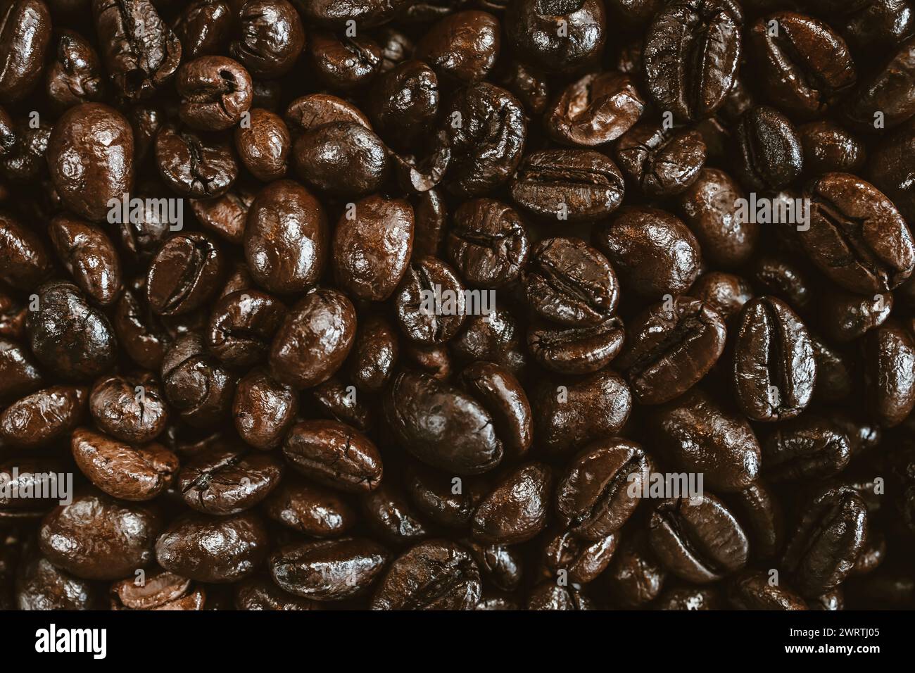 Roasted coffee beans background concept Stock Photo - Alamy