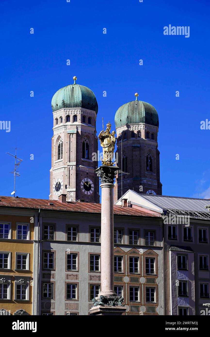 Church towers of the Munich Church of Our Lady behind the golden statue of the Virgin Mary on the Marian column, Church of Our Lady Munich, Bavaria Stock Photo