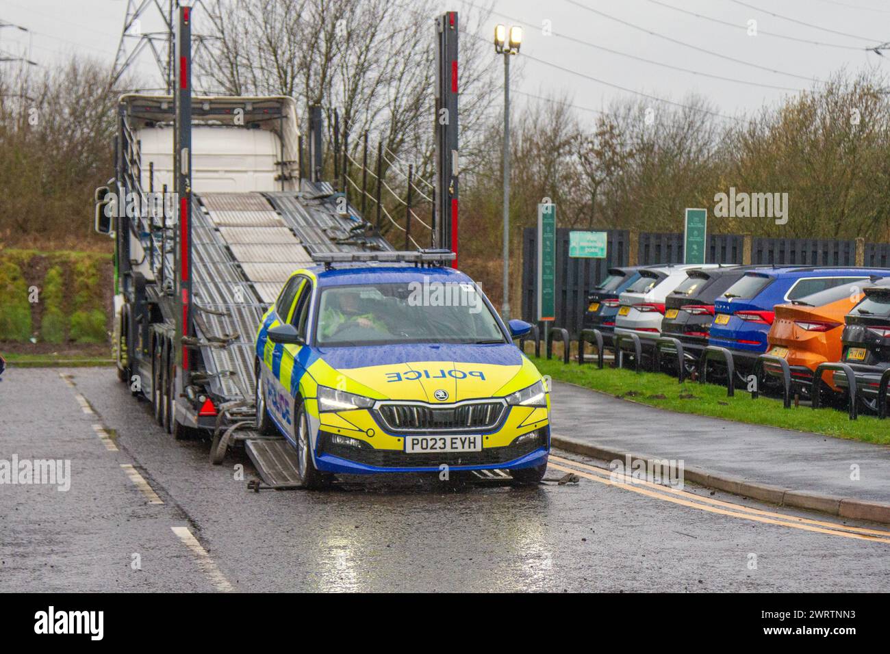 New Skoda Police vehicles being unloaded on car transporter. Replacement cars for Lancashire Police.  BMW, the original supplier, has stopped supplying police cars to forces across the UK after an inquest heard how a PC was killed in a crash on the M6 following an engine failure in his patrol car. There had been similar incidents involving police cars with the same type of engine in the years prior. Faults had been identified in a diesel engine associated with high mileage and long periods of engine idling. Stock Photo