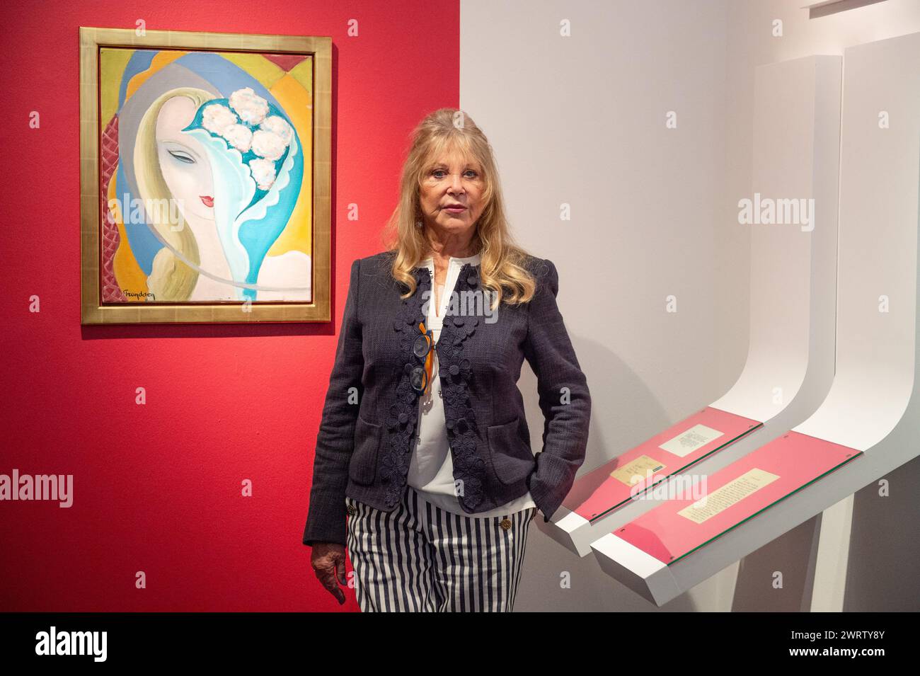 London, England, UK. 14th Mar, 2024. Model, Photographer, and Icon PATTIE BOYD, posing next to original cover art for the 1970 Derek and the Dominos album 'Layla', created by artist Emile Theodore Frandsen de Schomberg, estimated to be worth GBP 40,000-60,000, during a press call at Christie's in London. (Credit Image: © Thomas Krych/ZUMA Press Wire) EDITORIAL USAGE ONLY! Not for Commercial USAGE! Stock Photo