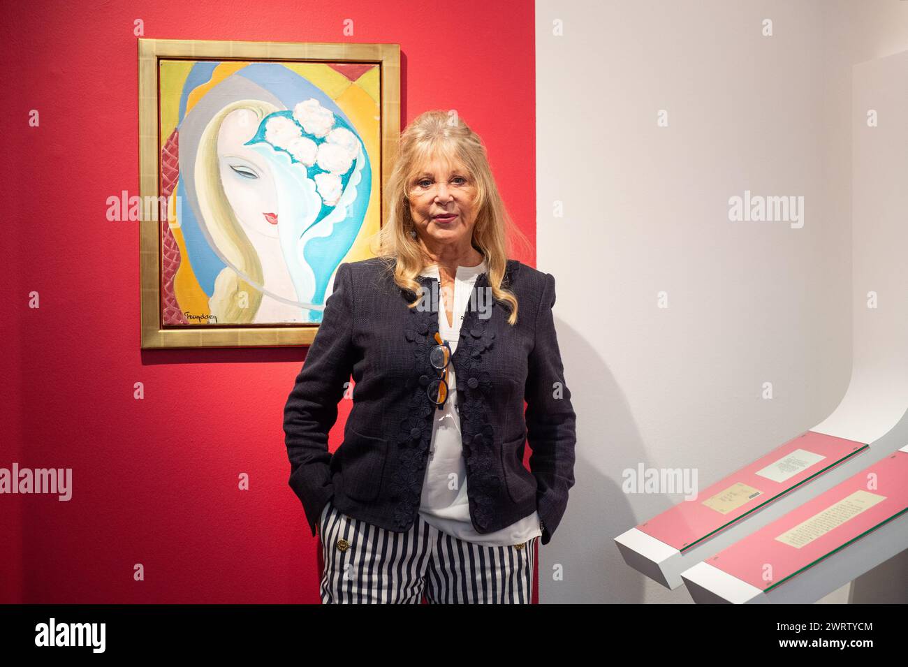 London, England, UK. 14th Mar, 2024. Model, Photographer, and Icon PATTIE BOYD, posing next to original cover art for the 1970 Derek and the Dominos album 'Layla', created by artist Emile Theodore Frandsen de Schomberg, estimated to be worth GBP 40,000-60,000, during a press call at Christie's in London. (Credit Image: © Thomas Krych/ZUMA Press Wire) EDITORIAL USAGE ONLY! Not for Commercial USAGE! Stock Photo