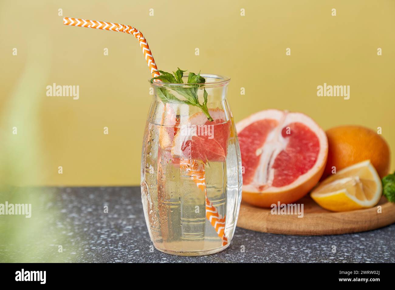 Vitaminized summer detox water. Aesthetic refreshing cocktails with citrus fruits. Low-alcohol drinks, hard seltzer cocktail concept. Stock Photo