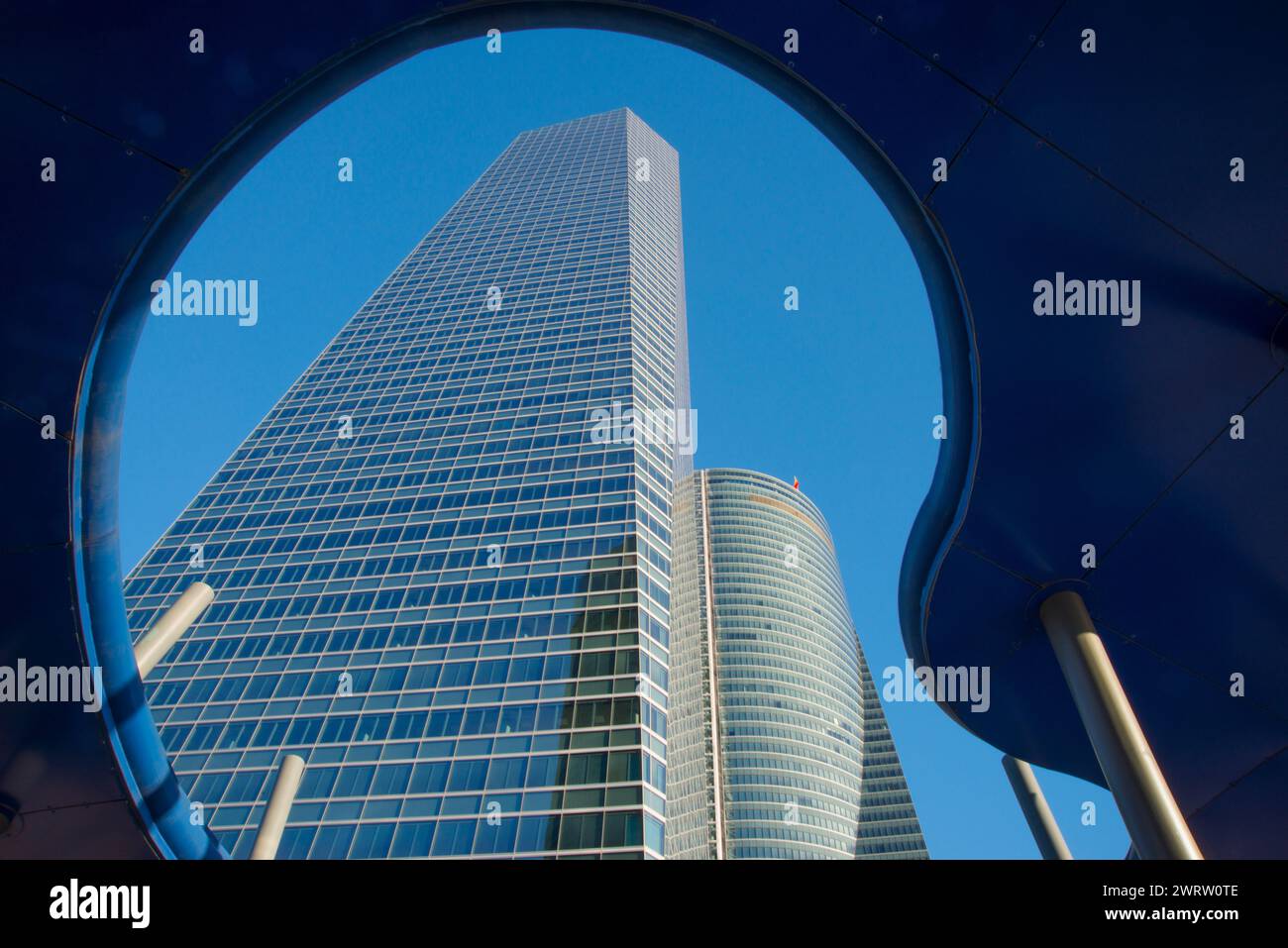 Cristal Tower and Espacio Tower, view from below a modern sculpture. CTBA, Madrid, Spain. Stock Photo