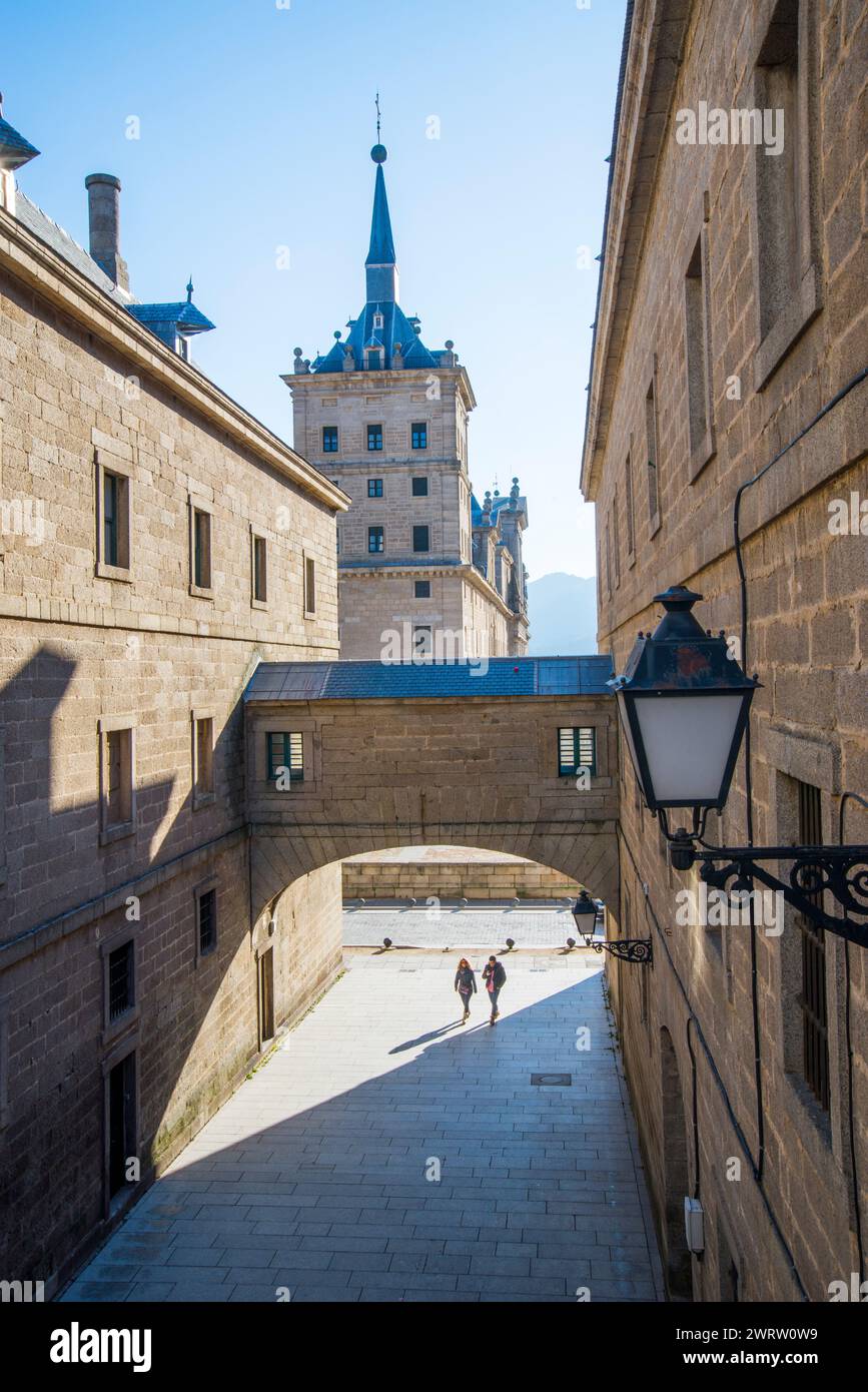 Street, arch and view of the Royal Monastery. San Lorenzo del Escorial, Madrid province, Spain. Stock Photo