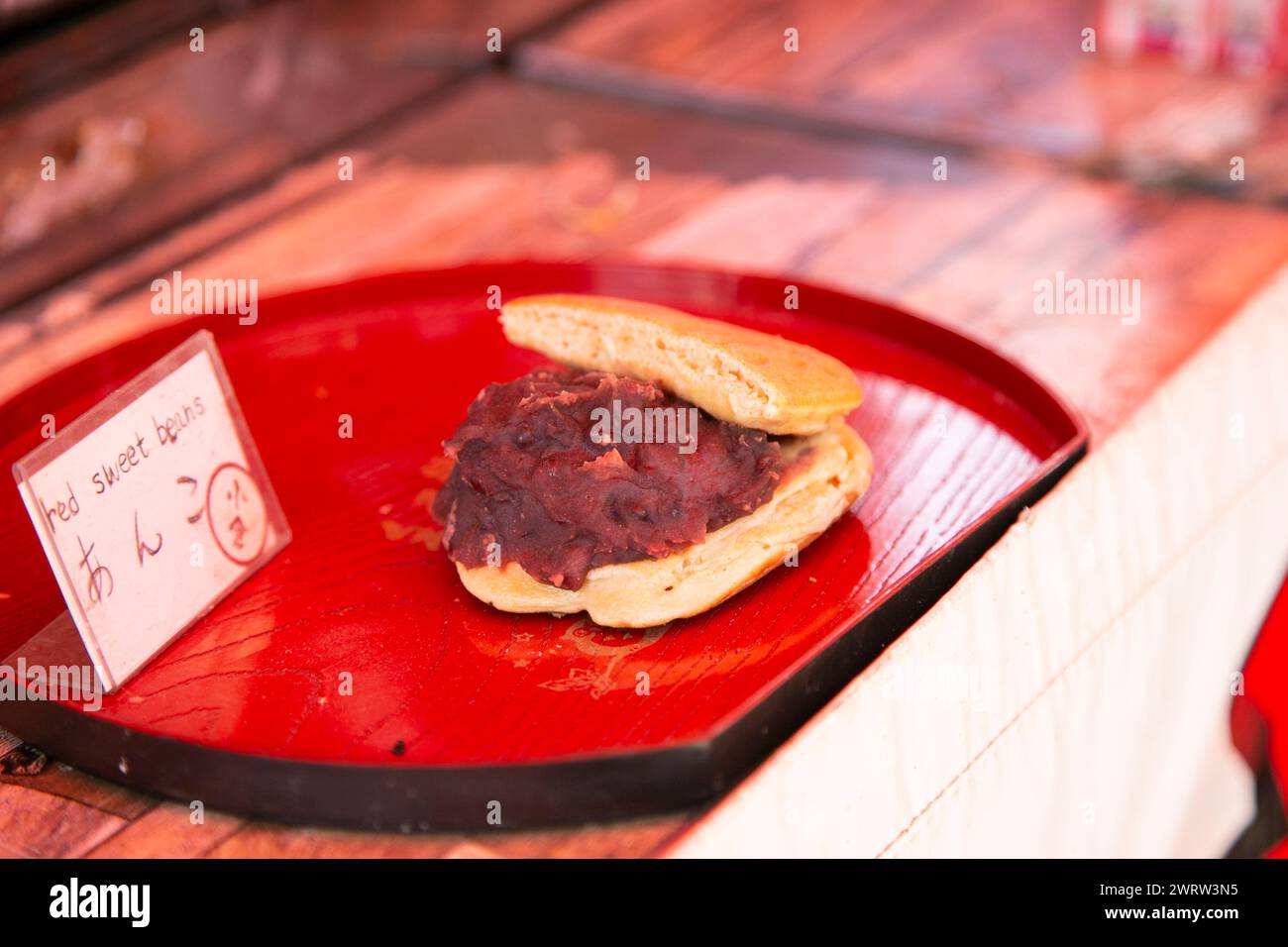 Traditional Japanese sweet stuffed azuki bean paste or anko at a Kyoto food market stall. Stock Photo