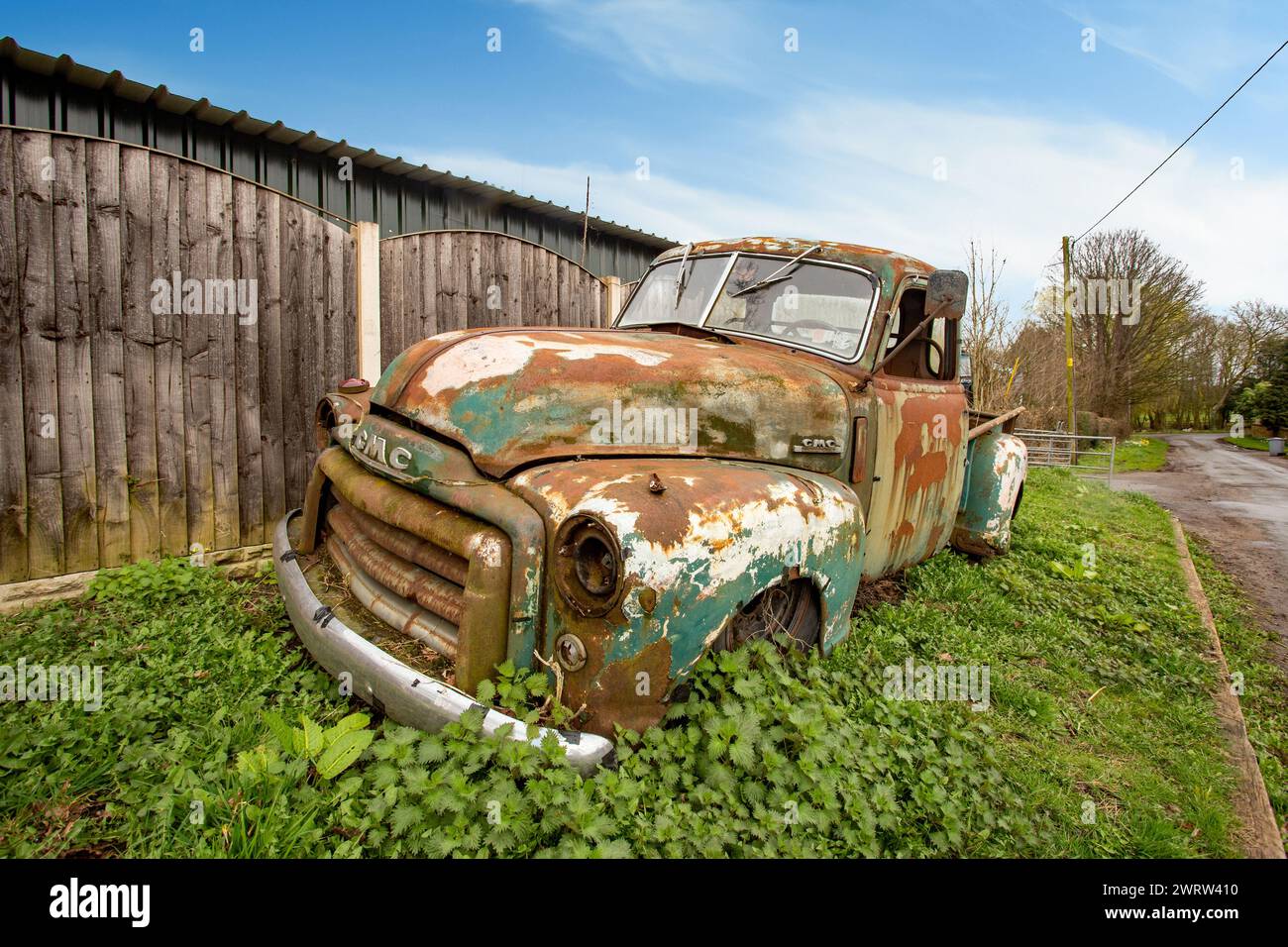 Old abandoned  1940s  General Motors Company GMC pick up truck at a breakers in the Cheshire village of Smallwood Stock Photo
