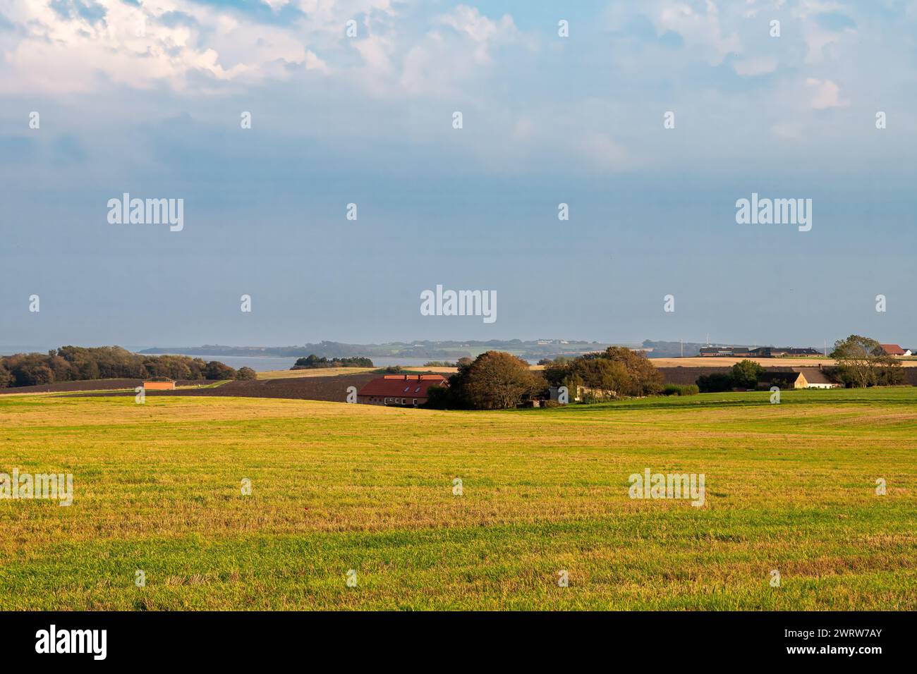 Scenic countryside view of farmland and pastures on Fur island overlooking Limfjord, Midtjylland, Denmark Stock Photo