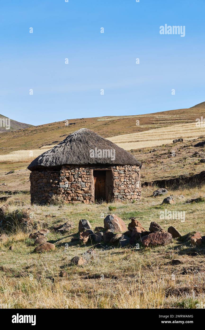 Semonkong, Lesotho - April 22nd 2023 - traditional round hut made of stones near Semonkong Stock Photo