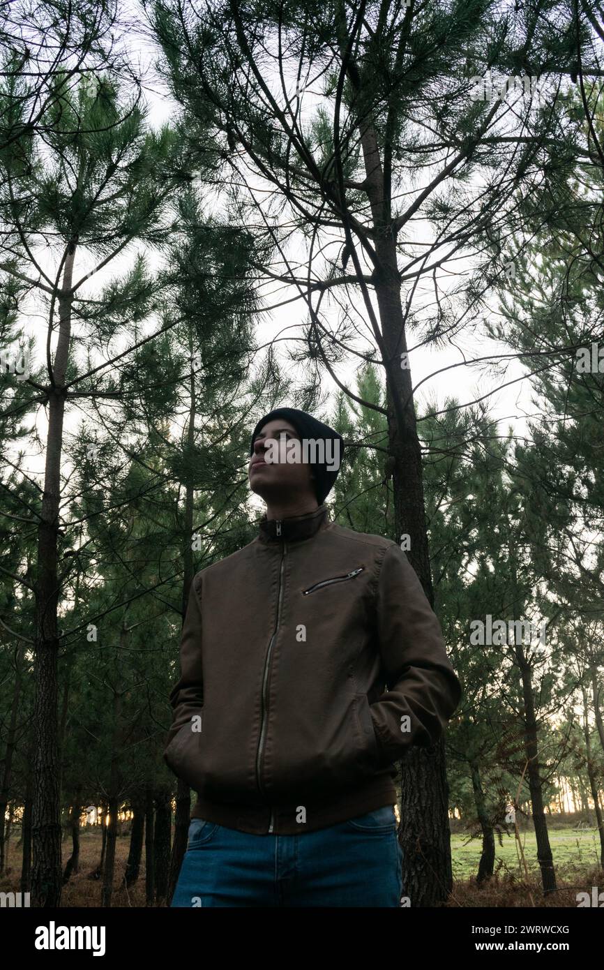 Stock Photo Of A Young Man In A Woolen Hat Standing Alone In A Forest ...