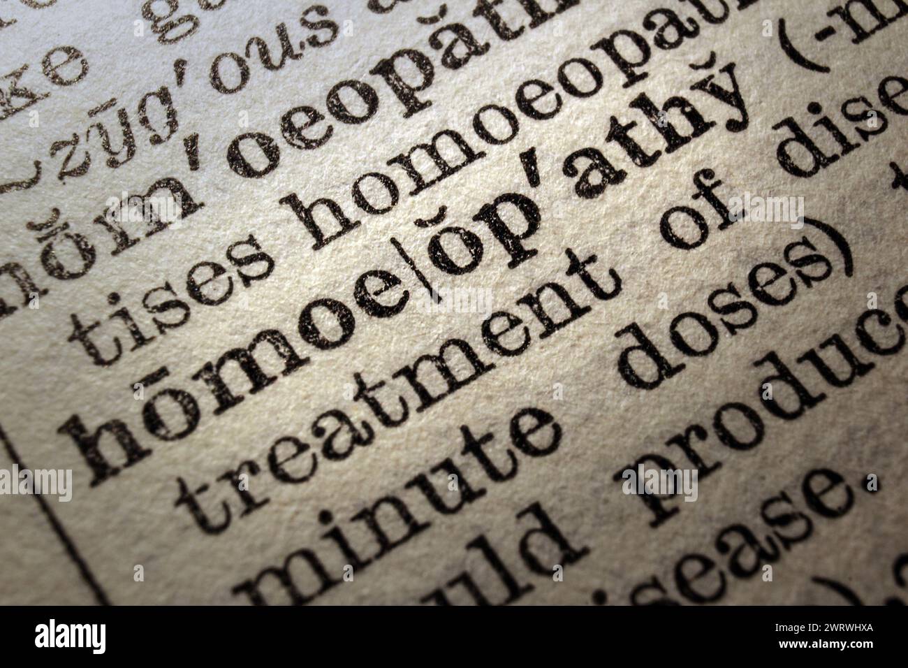 Word homeopathy on dictionary page, macro close-up Stock Photo