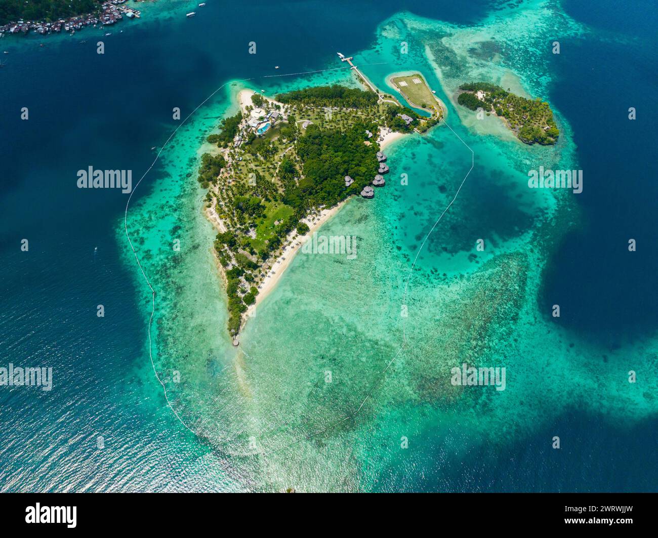 White beach surrounded with turquoise water and waves. Malipano Island ...