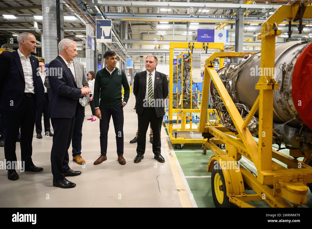 Director of Business Development & Future Programmes, Rolls-Royce plc Alex Zino (left), Rolls-Royce Group President Chris Cholerton (second left), Prime Minister Rishi Sunak (second right), and Conservative MP for Filton and Bradley Stoke Jack Lopresti (right) look towards an engine during a visit to the Rolls-Royce manufacturing facility in Bristol. Picture date: Thursday March 14, 2024. Stock Photo