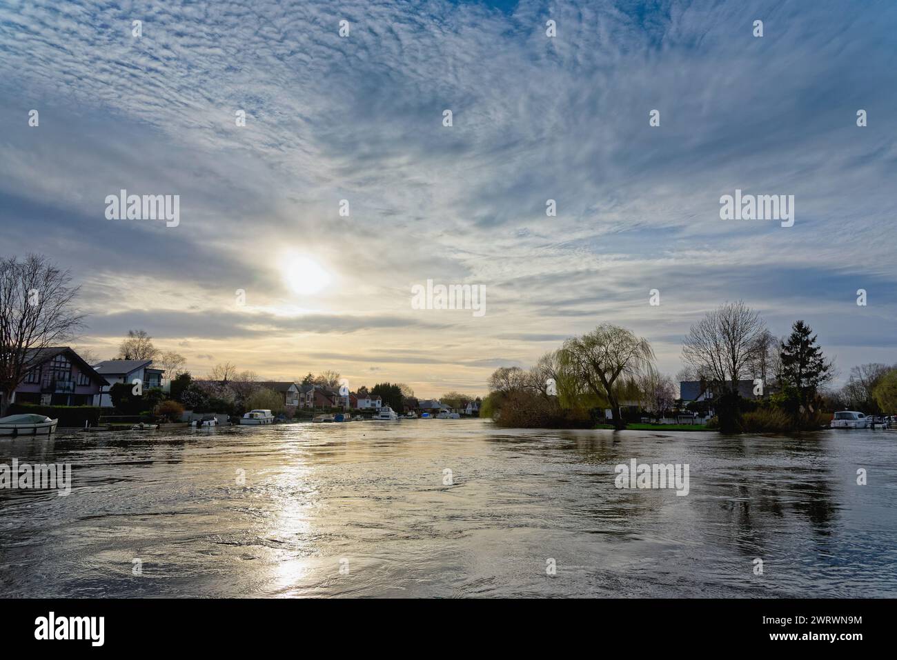 The River Thames in full flood at Shepperton on a winters evening sunset Surrey England UK Stock Photo