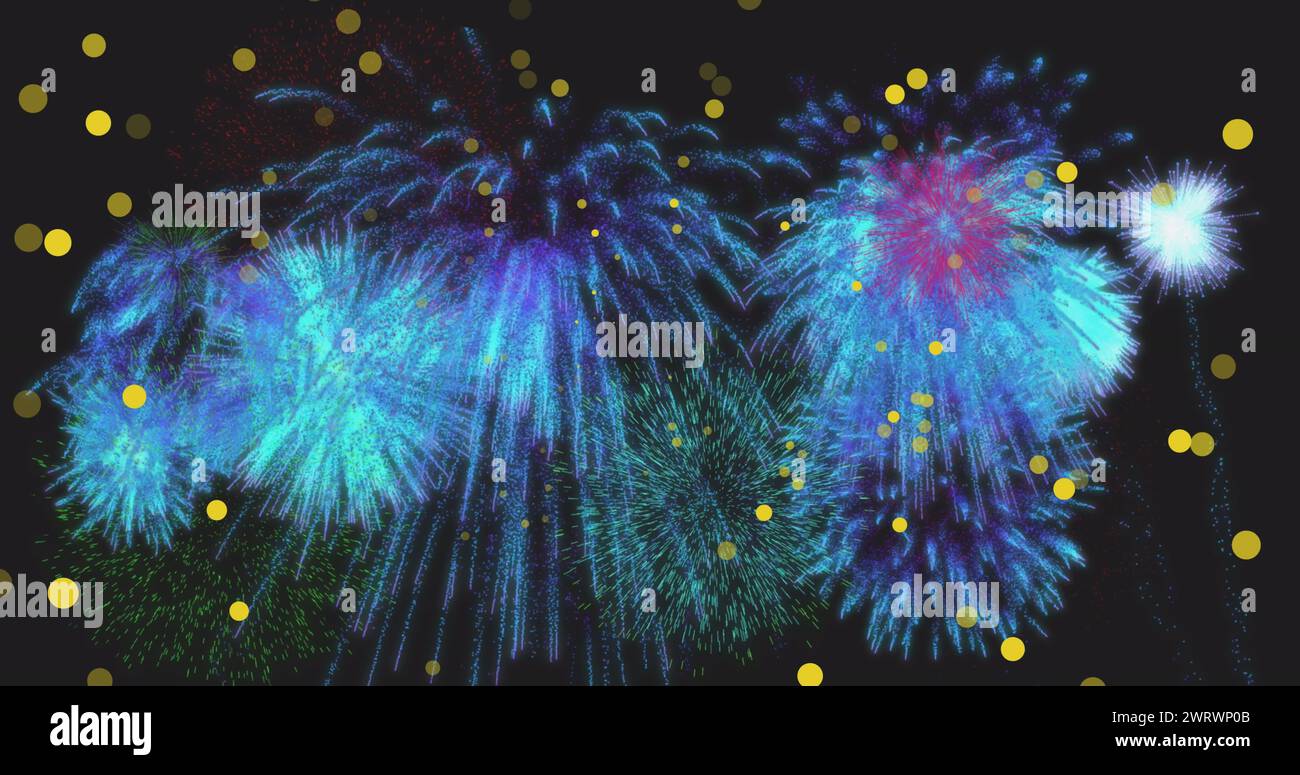 Image of yellow spots of light over blue new year fireworks exploding ...