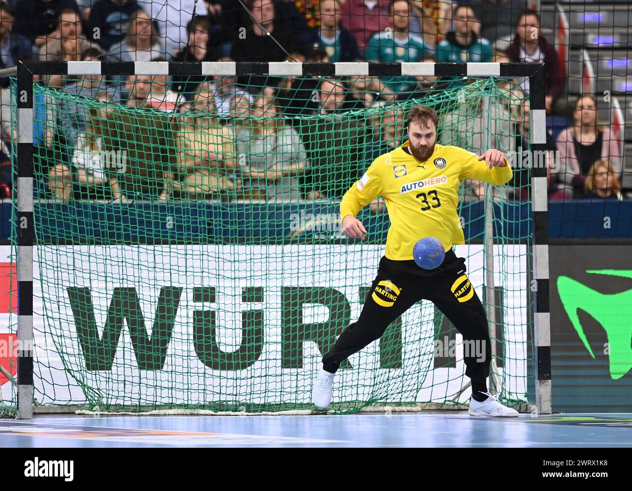 Hanover, Germany. 14th Mar, 2024. Handball: Olympic Qualification, Germany - Algeria, Qualification, Tournament 2, Matchday 1, ZAG Arena. Germany's goalkeeper Andreas Wolff saves the ball. Credit: Swen Pförtner/dpa/Alamy Live News Stock Photo