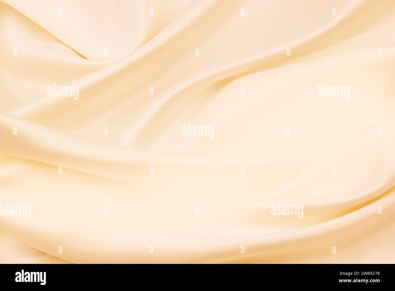 Ripples in orange silk fabric Stock Photo