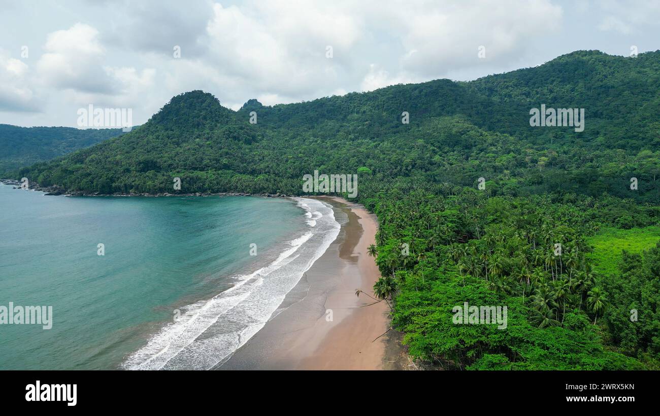 A green beach and ocean in Praia Grande, Sao Tome, South Africa Stock Photo