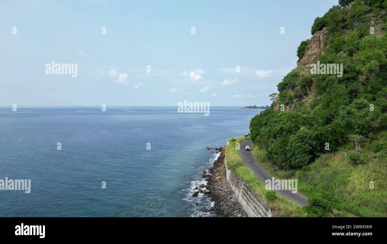 A green beach and ocean in Praia Grande, Sao Tome, South Africa, Stock Photo