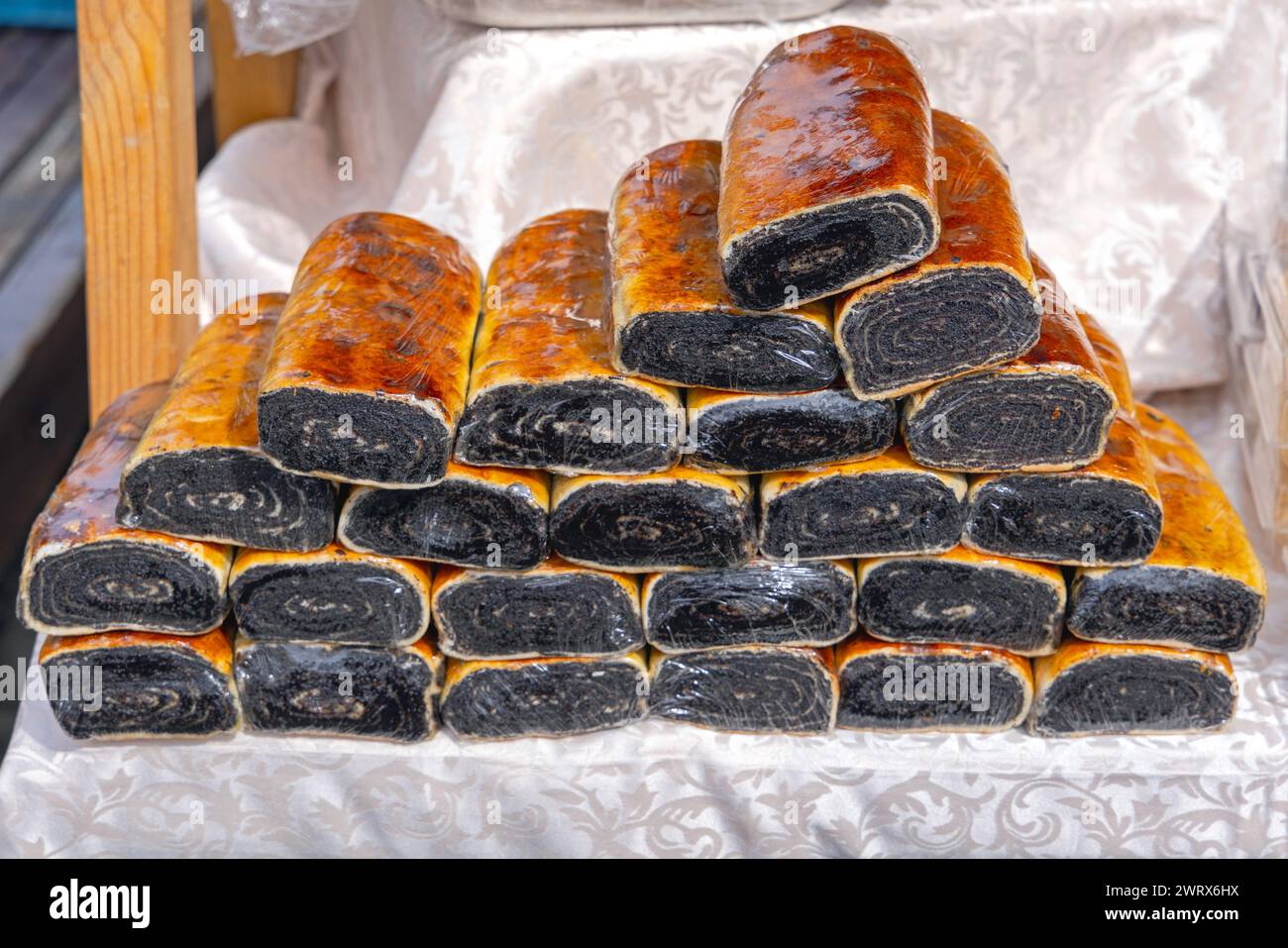 Stacks of Black Poppy Seed Cakes at Farmers Market Stock Photo