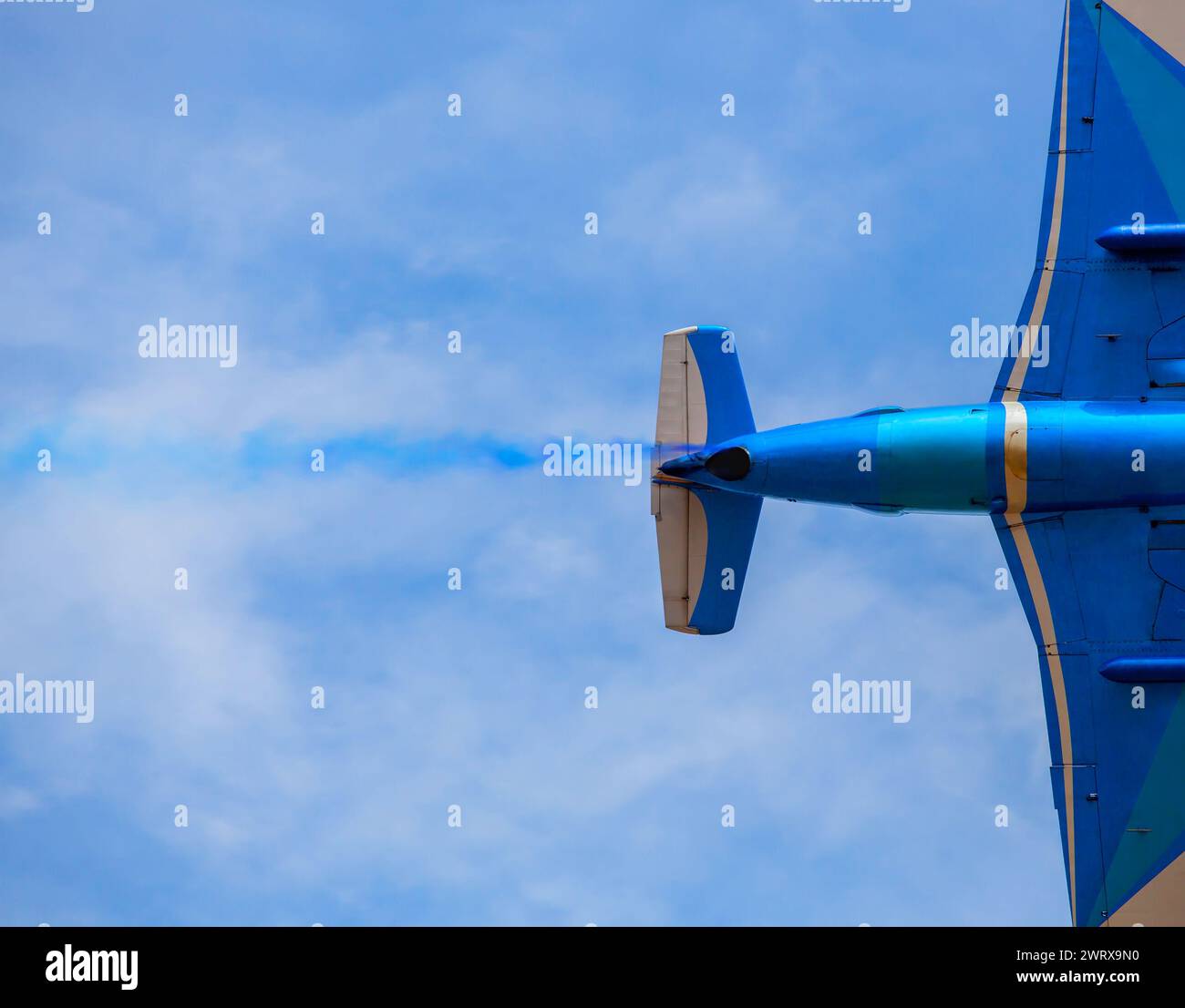 Flying in the sky on a background of clouds the plane Stock Photo