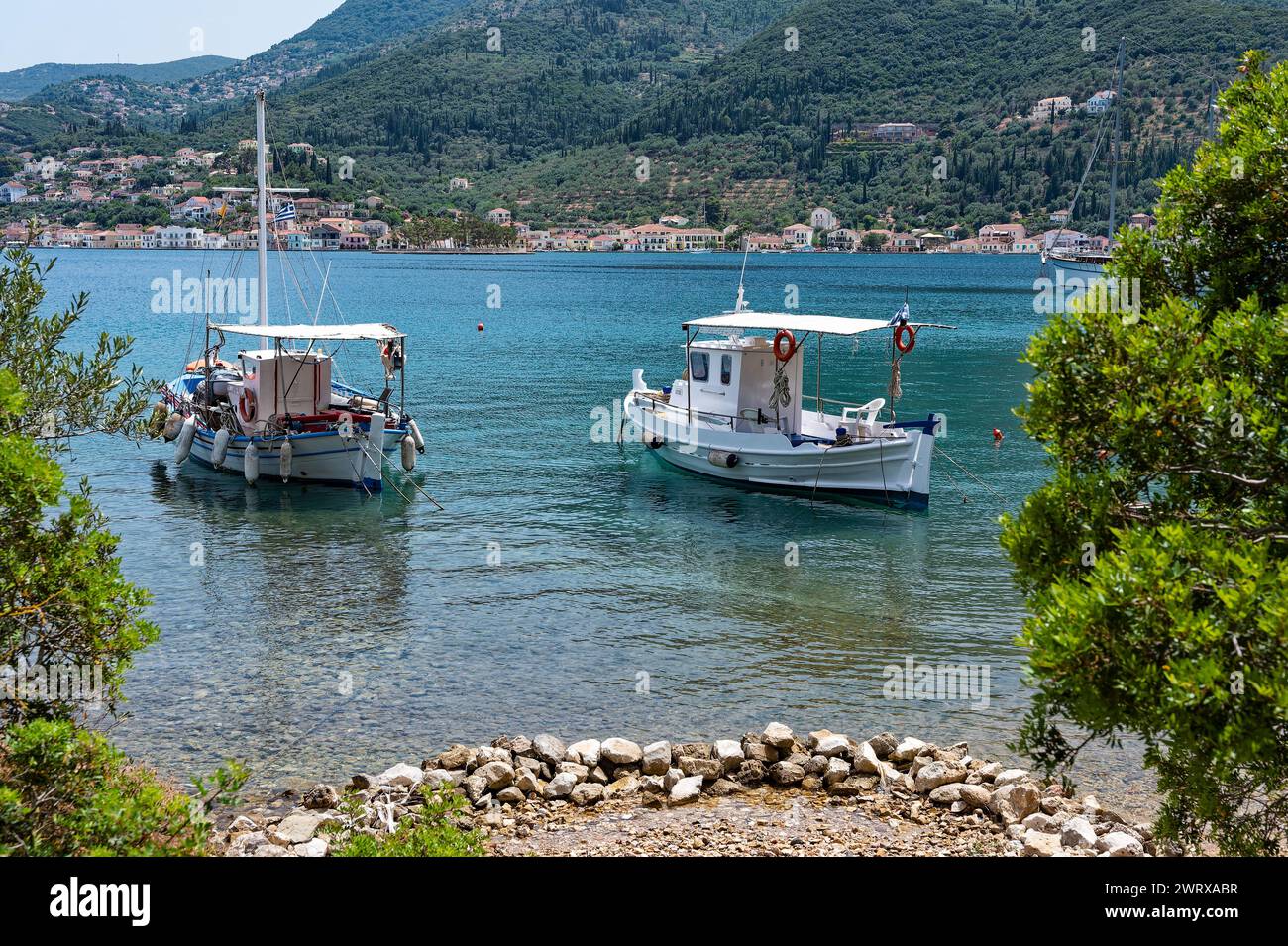 Traditional wooden fishing boats at the harbour of Vathy in Ithaka, Greece Stock Photo